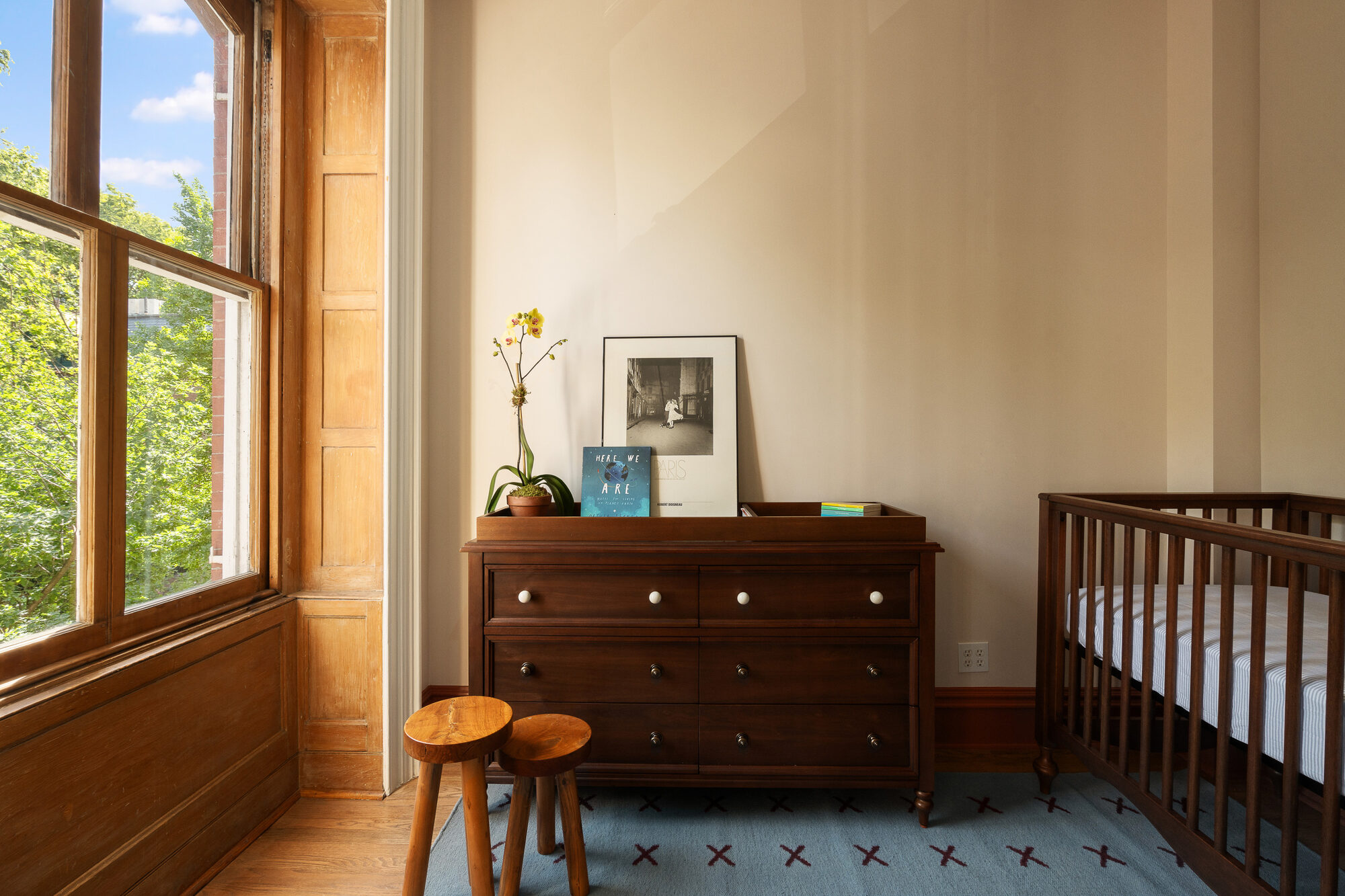 A third bedroom, currently arranged as a nursery