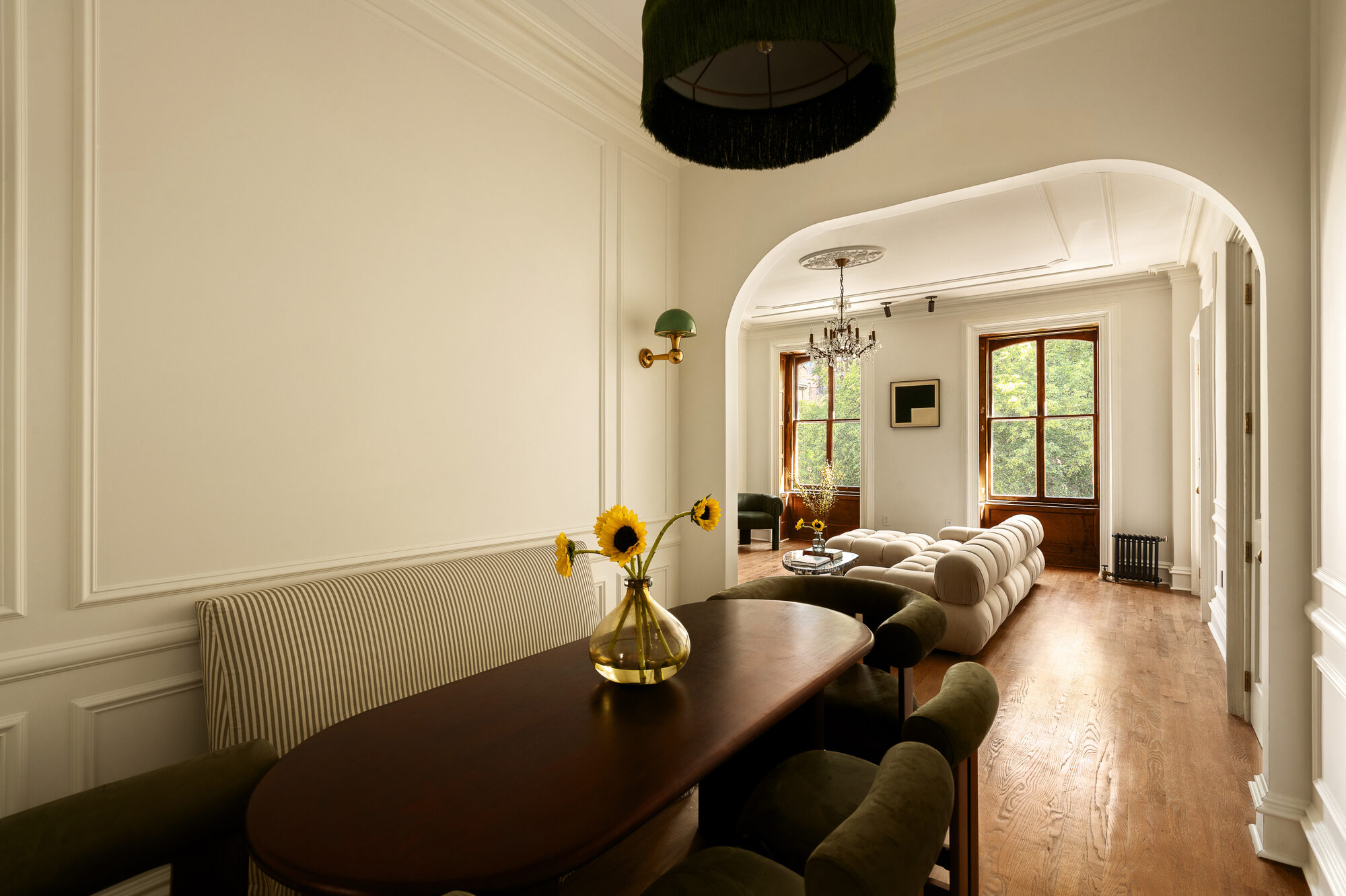 Dining room framed by graceful arched openings