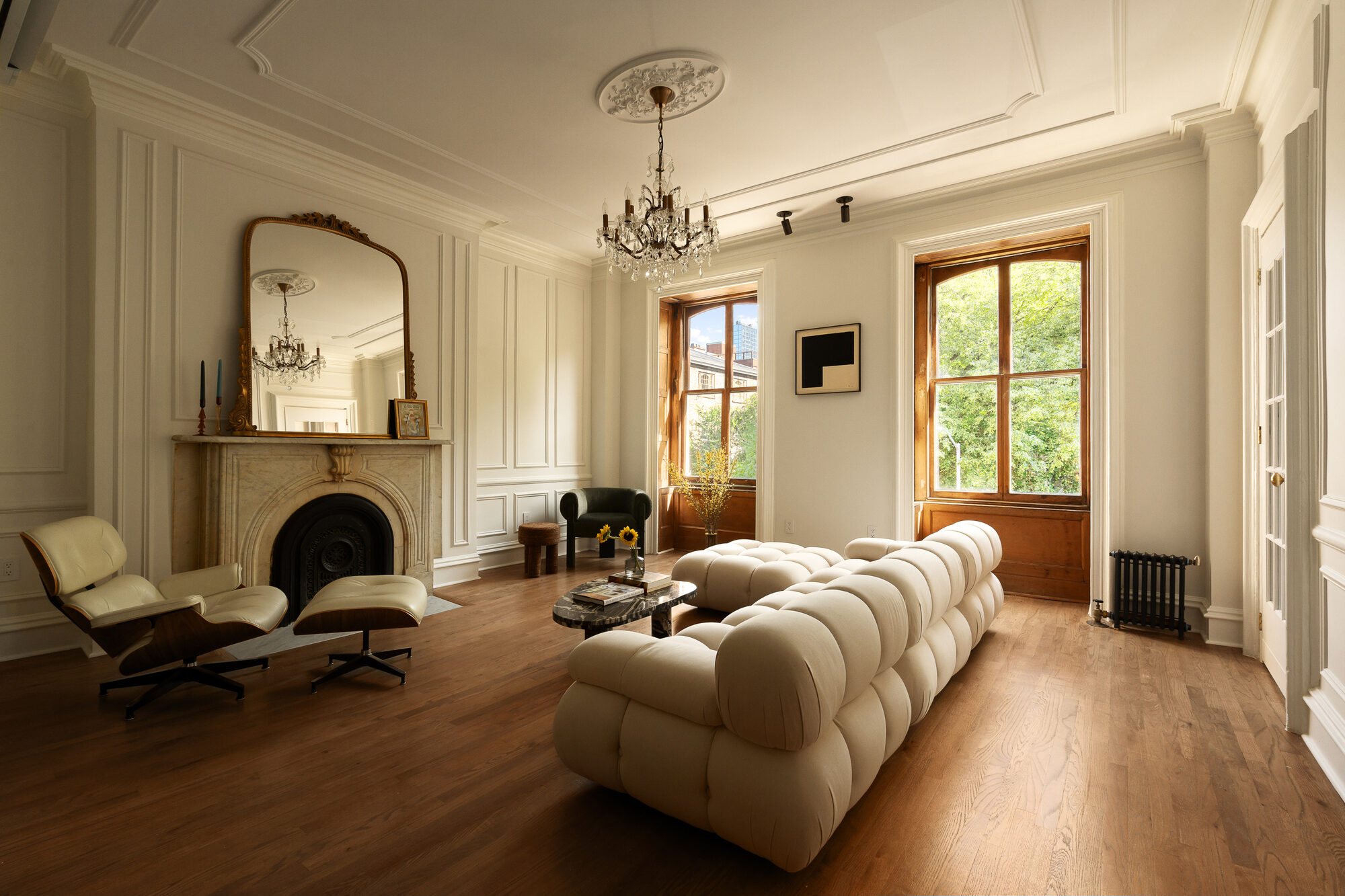 Living room with original fireplace and a reading chaise