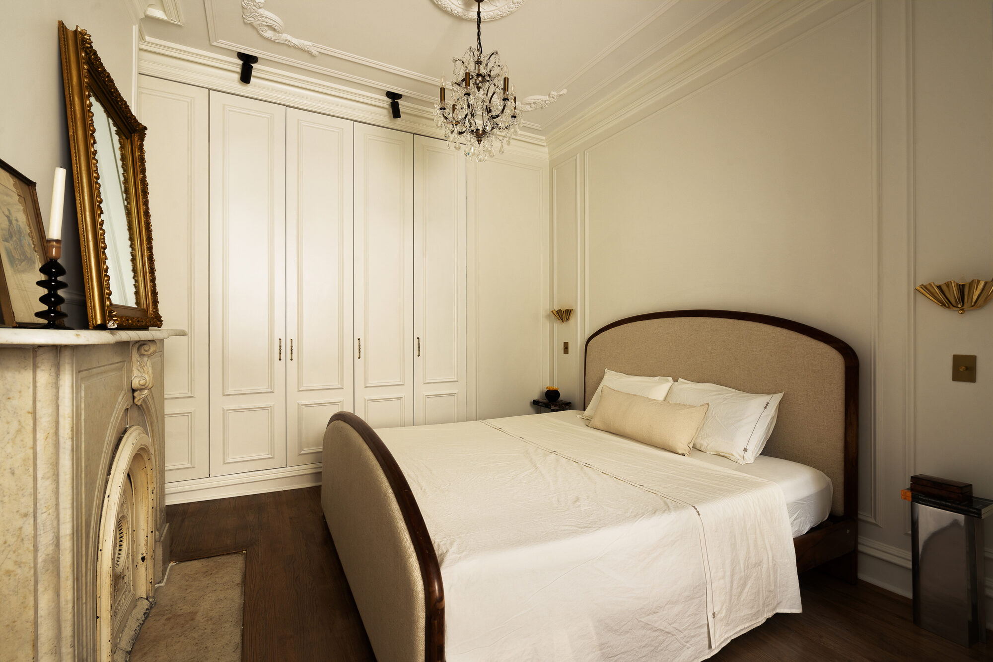 Primary bedroom with fireplace and custom closets